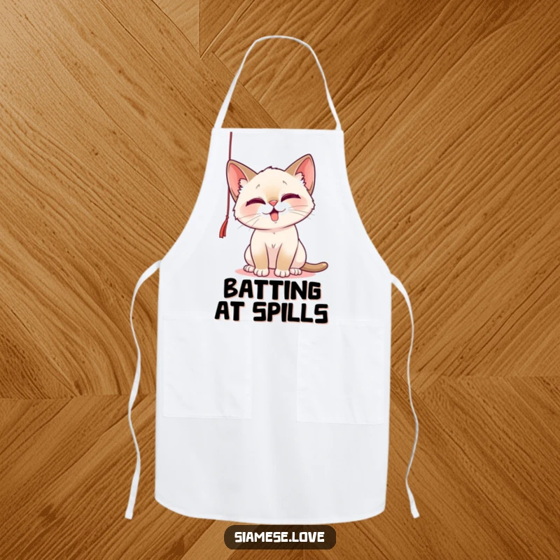 Funny Apron featuring a playful Siamese cat batting at a dangling string, making kitchen tasks a delightful and humorous affair.
