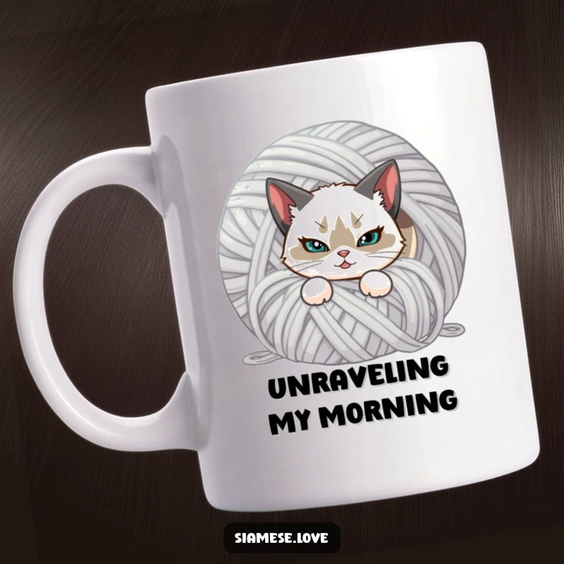 Funny mug featuring a Siamese cat with a mischievous smirk, hiding behind a giant ball of yarn. Adorable and sneaky feline art.