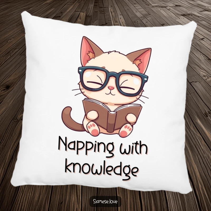 Funny Siamese cat pillow showing a feline wearing glasses, reading a book upside down, offering comfort and literary humor.