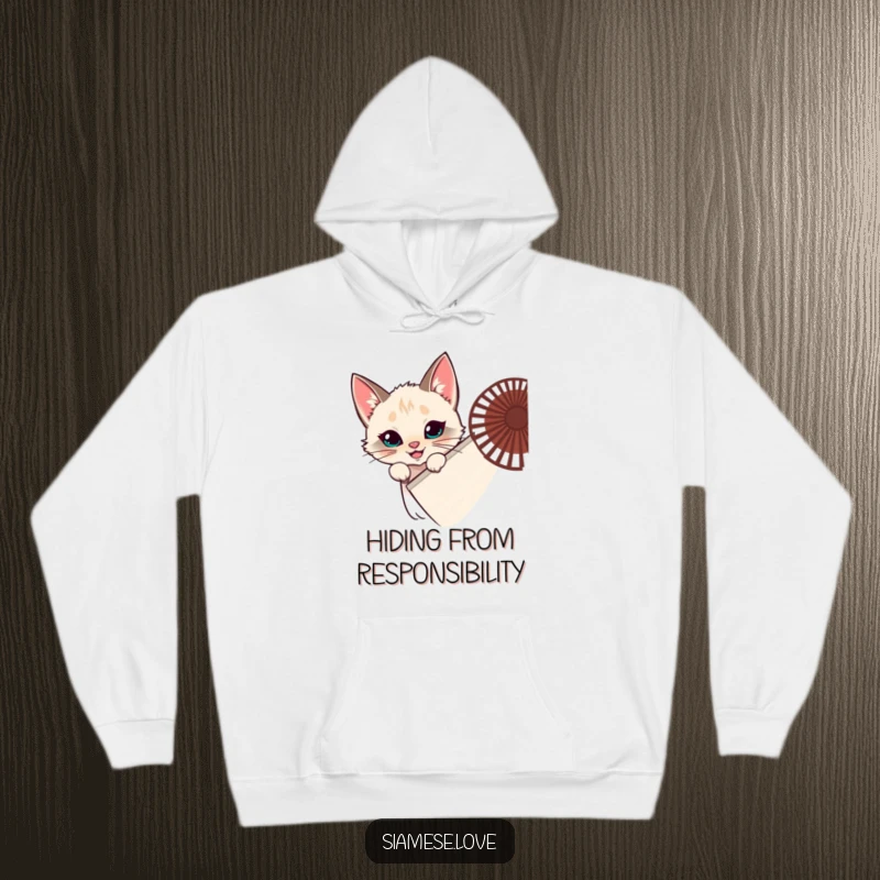 Funny Siamese cat hoodie, feline hiding behind a fan, peeking, mischievous grin, cozy and playful, great funny gift.