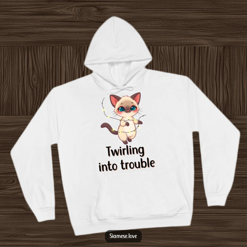 Funny Siamese cat hoodie, feline twirling with sparkling holiday lights, cozy and magical, great funny gift.