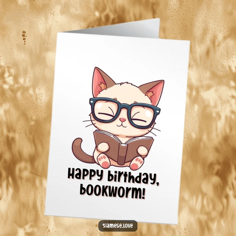 Funny Free Printable Birthday Card: Siamese cat in oversized glasses reads a book upside down with a puzzled look.