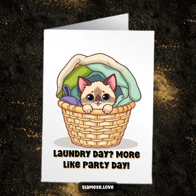 Funny Free Printable Birthday Card: Mischievous Siamese cat peeking from overflowing laundry basket, ready for fun.