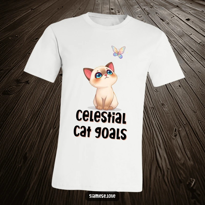 Funny Siamese Cat T-Shirt: A curious cat looking with wide eyes at a glowing, hovering butterfly, evoking awe and wonder.