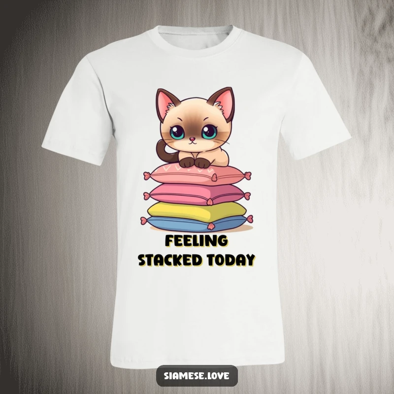 Funny t-shirt depicting a Siamese cat delicately balancing on a stack of colorful cushions, showcasing feline elegance.
