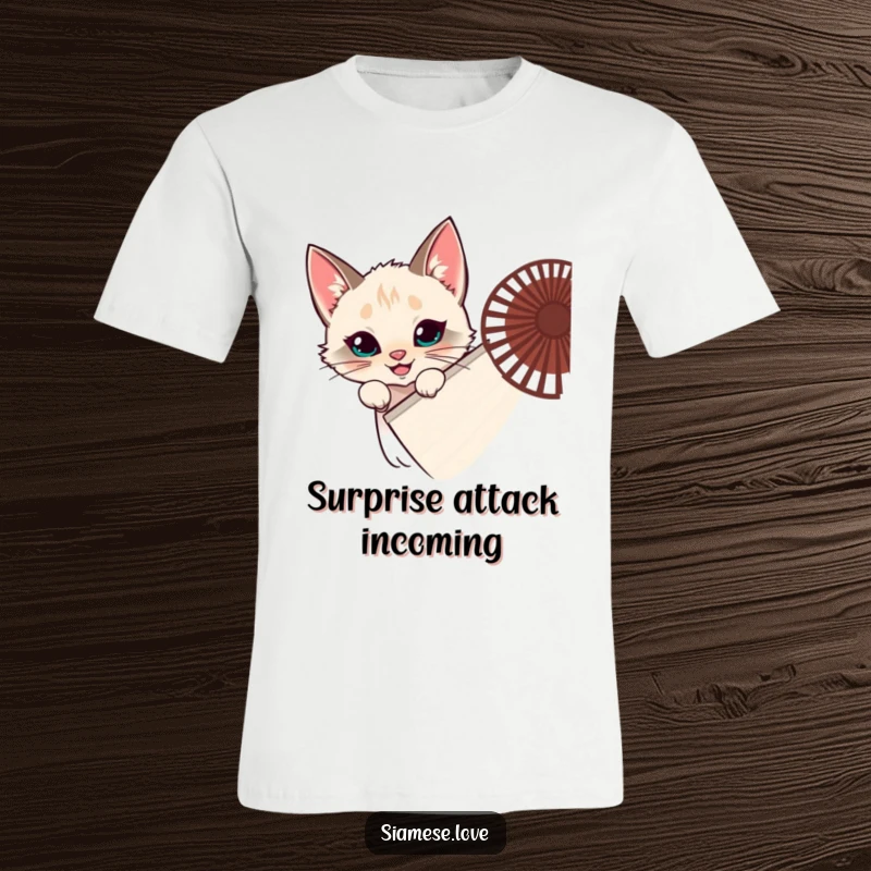 Funny Siamese cat t-shirt, feline hiding behind a fan, peeking with a grin, mischievous prankster, perfect funny gift.