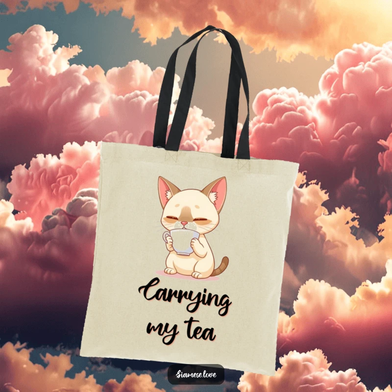 Funny Siamese cat balancing a teacup on its nose on a tote bag, demonstrating focus and a love for tea.