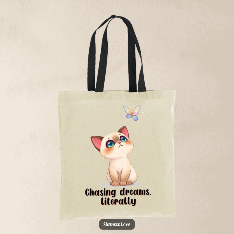 Funny Siamese Cat Tote Bag: A chic bag showcasing a cat's awe at a luminous butterfly, great for everyday magic.